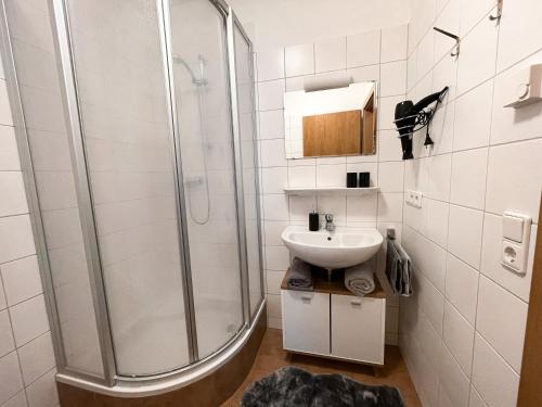 a bathroom with a shower and a sink at Apartment Alpzbase in Kaprun