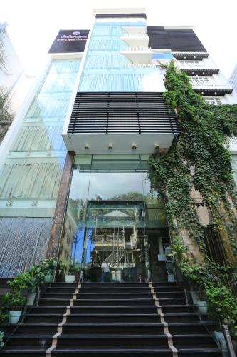 a staircase leading up to a tall building at Valentine Hotel in Ho Chi Minh City