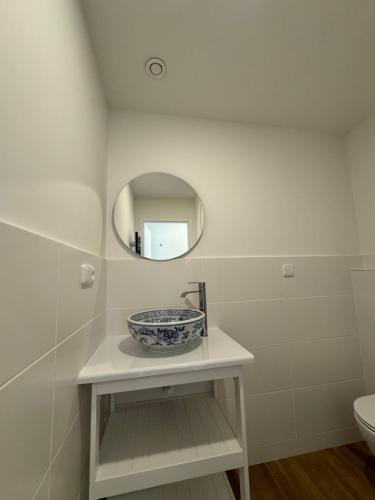 a bathroom with a sink and a mirror at Tkalcovna U Zlatého potoka in Dobřany