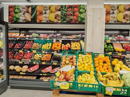 a grocery store filled with lots of fruits and vegetables at Sea view Orange by Vellaris, Luxury Mobile Home in Mali Lošinj