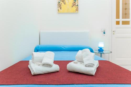 Postel nebo postele na pokoji v ubytování B&B Torre Lauro
