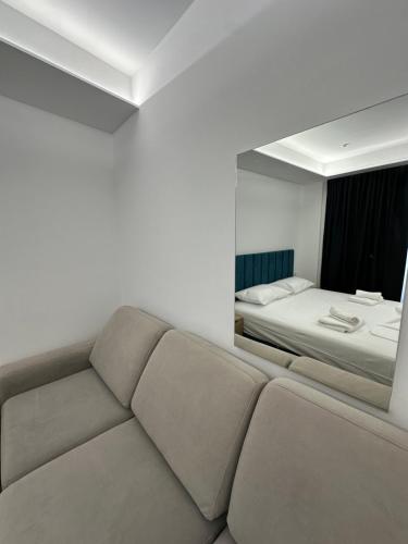 Postel nebo postele na pokoji v ubytování IO's Apartments