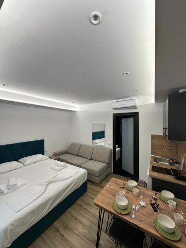 Postel nebo postele na pokoji v ubytování IO's Apartments