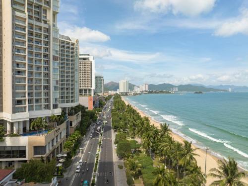 a view of the beach and buildings and the ocean at Havana Nha Trang Hotel in Nha Trang