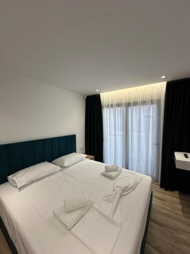 Postel nebo postele na pokoji v ubytování IO's Apartments
