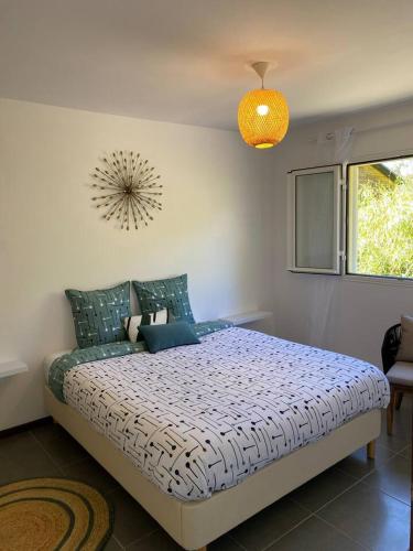 a bedroom with a large bed in a room at Hortensia in La Plaine des Palmistes
