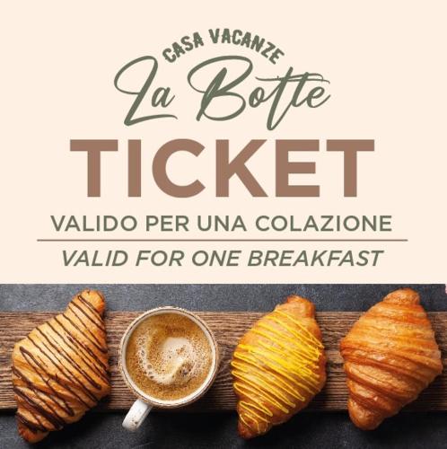 a table with a cup of coffee and some croissants at La botte in Mesagne