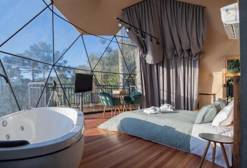 Voodi või voodid majutusasutuse Orion Glamping Hospedagem Domo Geodésico em Urubici toas
