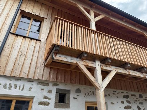 a deck on the side of a house at Bio-Hof Lexmühle in Hammern