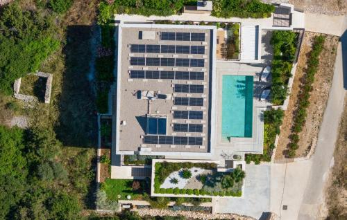 an overhead view of a building with a pool at Pet Friendly Home In Rukavac With Sauna in Rukavac