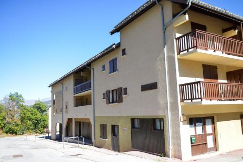 an apartment building with balconies on the side of it at VALLOIRE - Les Verneys - Thymel in Valloire