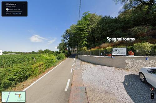 a road with a car parked on the side at Spagnoi Rooms in Castelnuovo del Garda
