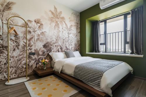 Postel nebo postele na pokoji v ubytování Livetour Hotel Gulao Water Town OCT Jiangmen
