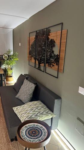 a living room with a couch and a table at La stanza sul Porto in Pozzuoli