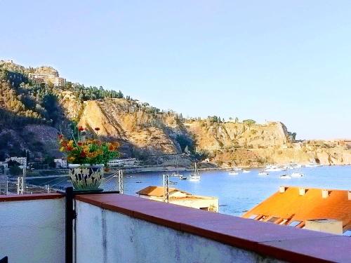 a view of a harbor with boats in the water at Hotel Pensione Cundari in Taormina
