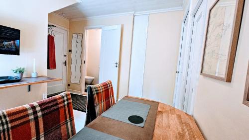 a dining room with a table and chairs at Ullaredsgården B&B Express in Ullared