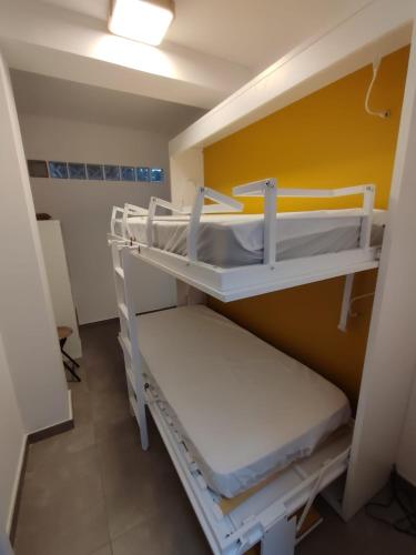 a hospital room with two bunk beds in it at Ca Salamandra in Albalat de Taronchers