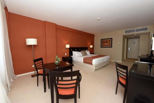 Katil atau katil-katil dalam bilik di Camberland Resort & Spa Ramallo