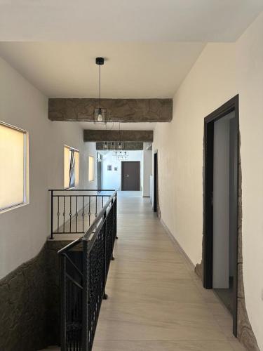 a hallway with a stairway leading to a room at Pensiunea CASA VISELOR in Sviniţa