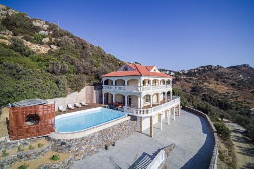 an aerial view of a mansion with a swimming pool at Villa Sun Rock - Ravdoucha in Kolymvari