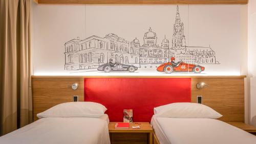 a bedroom with two beds and a drawing of a city at Los Lorentes Apartments Bern City in Bern