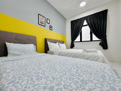 a bedroom with two beds and a window at The Sun 1 or 3BR Bayan Lepas 4 to 10 pax WL in Bayan Lepas