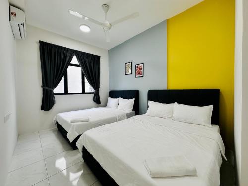 two beds in a room with colorful walls at The Sun 1 or 3BR Bayan Lepas 4 to 10 pax WL in Bayan Lepas