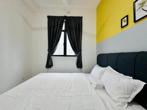 a bedroom with a white bed with a window at The Sun 1 or 3BR Bayan Lepas 4 to 10 pax WL in Bayan Lepas
