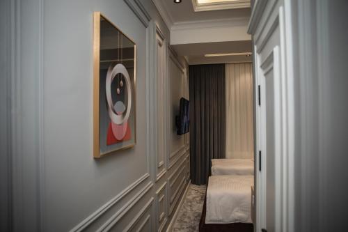 a hallway of a hotel room with two beds at Qadim Hotel in Samarkand