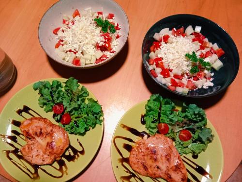 a table with plates of food and bowls of food at Penzion Václav in Hnojní
