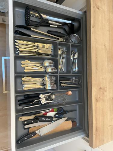 a drawer full of utensils in a kitchen at Julian's flat ruhig und zentral Kongress-Graz in Graz