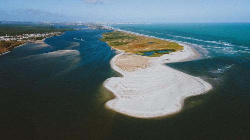 an aerial view of an island in the ocean at Casa Ilha| beira mar, piscina aquecida, 4 suítes in Marechal Deodoro