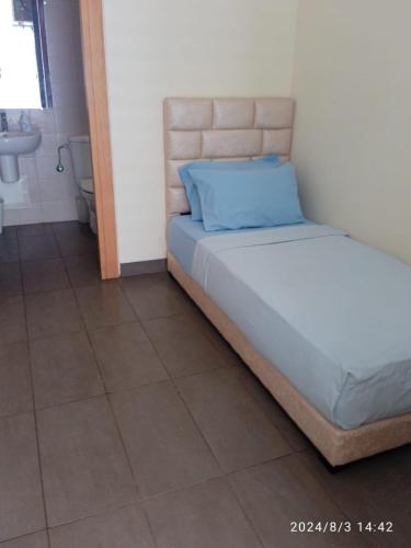 a bedroom with a bed with a blue pillow on it at Ocean View Apartment - Anfa Place - in Casablanca
