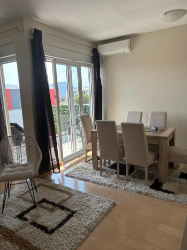 a dining room with a table and chairs at Apartment Ana in Podgorica