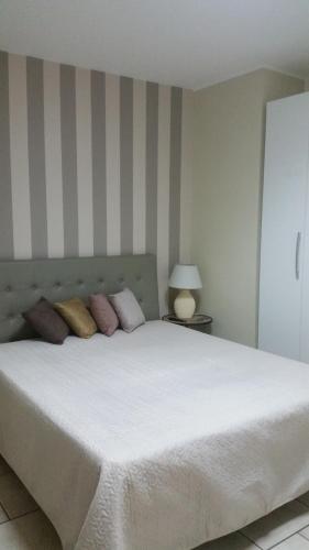 Ένα ή περισσότερα κρεβάτια σε δωμάτιο στο Hotel Sirio