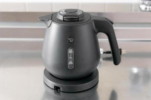 a black tea kettle sitting on top of a counter at Dotonbori East Residence Haru - Self Check-In Only in Osaka