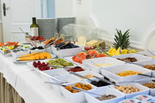 a buffet of different types of food on a table at Hotel Goldener Stern in Caldaro
