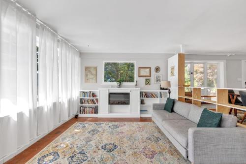 a living room with a couch and a fireplace at Robin's Rest home in Chapel Hill