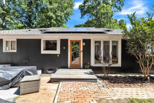 a house with a solar roof on a patio at Robin's Rest home in Chapel Hill