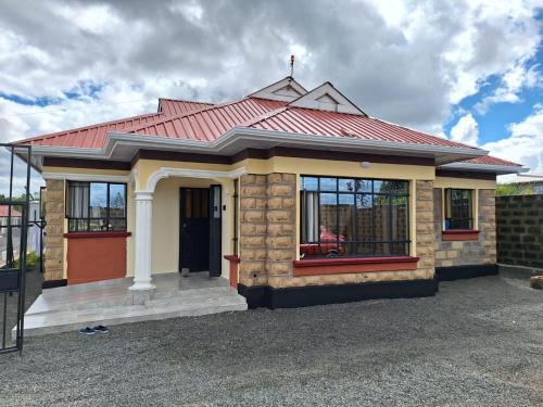 a small house with a red roof at Mellow Homes 3 - Own compound in Kitengela 