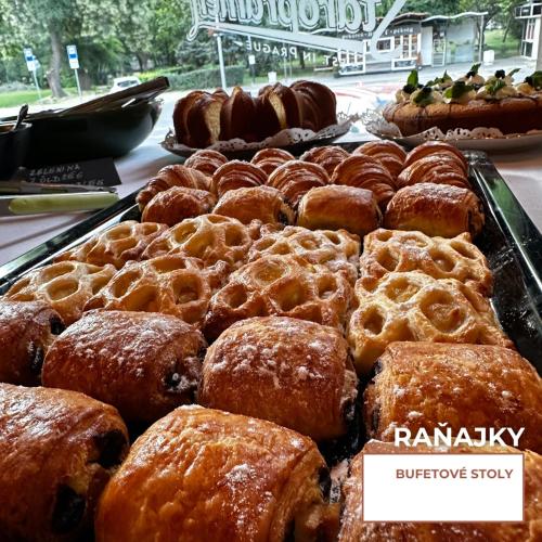 a bunch of pastries on display in a bakery at HOTEL EUROPA in Komárno