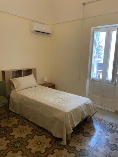 Ένα ή περισσότερα κρεβάτια σε δωμάτιο στο Domus Mea