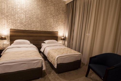 Cama o camas de una habitación en Old Meidan Tbilisi By Urban Hotels