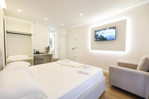Postel nebo postele na pokoji v ubytování Dadu Rooms