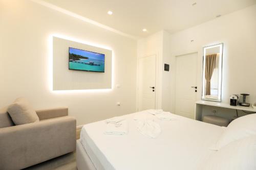 Postel nebo postele na pokoji v ubytování Dadu Rooms