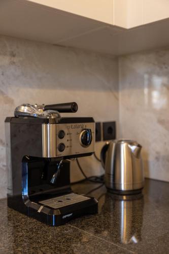 a coffee maker sitting on top of a counter at ARCHONTIKO 1922 in Argostoli