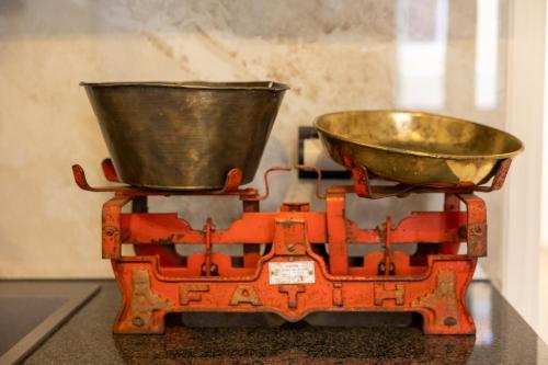 a scale with a bucket on top of it at ARCHONTIKO 1922 in Argostoli