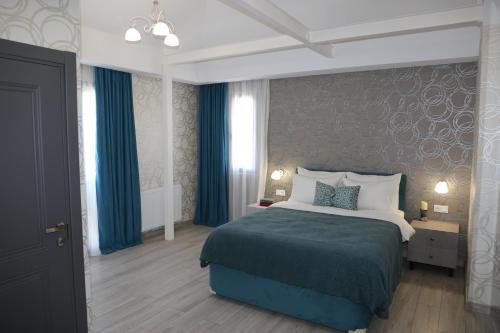 Postel nebo postele na pokoji v ubytování Hotel Saguramo Bliss