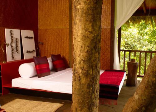 Krevet ili kreveti u jedinici u okviru objekta Rainforest Resort