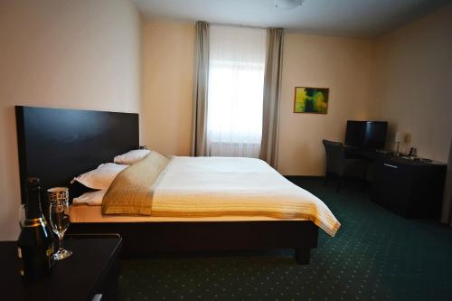 מיטה או מיטות בחדר ב-Kaštel Hotel